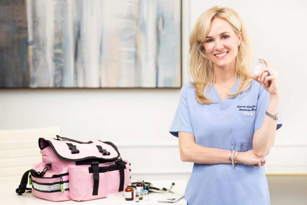 Dr. Lauren Leavitt, M.D., board-certified Emergency Medicine physician and co-founder of Amanecia Health Houston, with medical supplies for in-home patient visits